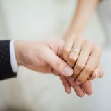 Wedding moments. Newly wed couple's hands with wedding rings